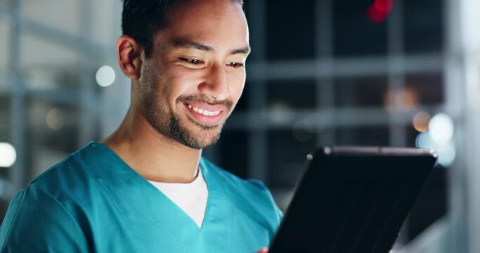 Doctor, man and smile for tablet in hospital at night for medical analysis, telehealth or online results. Happy asian surgeon working late on research, digital healthcare information or planning data