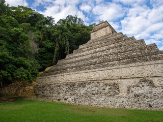 Beautiful photo of a Mayan temple at the archeological site in Palenque, Mexico - archeological site ruins