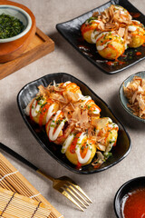 Takoyaki is a ball-shaped Japanese snack made of a wheat flour-based batter and cooked in a special molded pan