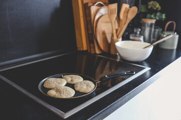 Cooking breakfast, pancakes in a pan
