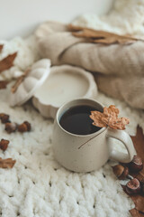 Cup of hot tea and a leaf, autumn mood