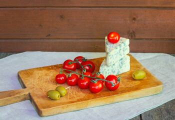 Blue cheese, cherry tomatoes and olives.