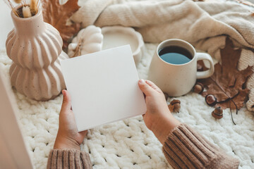 Empty postcard with space for your text in hands, autumn mood
