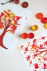 Children's creativity, autumn drawing with paints close-up