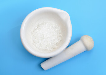 Sodium thiosulfate or sodium thiosulphate on blue background