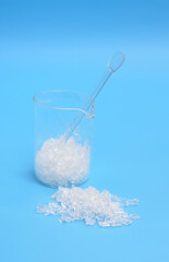 Sodium thiosulfate or sodium thiosulphate on blue background