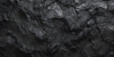 Naklejka premium Black white rock texture. Rough mountain surface. Close-up. Volumetric stone background with space for design. Dark gray grunge backdrop. Wide banner. Panoramic