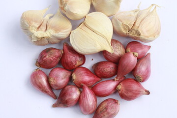 shallots and garlic (cooking herbs) isolated white background