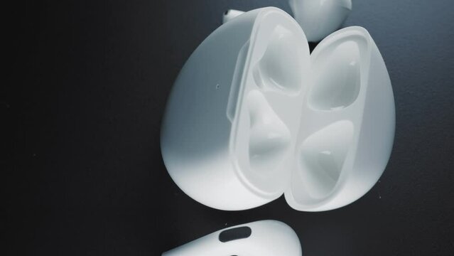 Close-up of white headphones with storage case