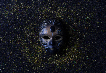blue masquerade eye mask isolated on black background