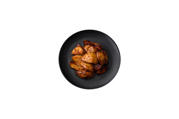 Delicious grilled potato slices with garlic, spices and herbs