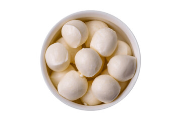 Delicious fresh mozzarella cheese in the form of small balls with salt and spices