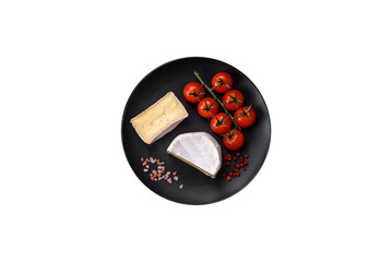 Delicious fresh brie cheese in the form of a mini head with cherry tomatoes