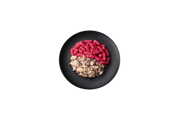 Delicious fusilli pasta with beetroot pesto, parmesan, salt and spices