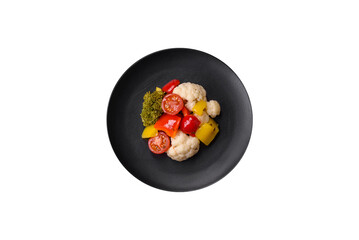 Delicious fresh salad of broccoli, cauliflower, sweet peppers and cherry tomatoes