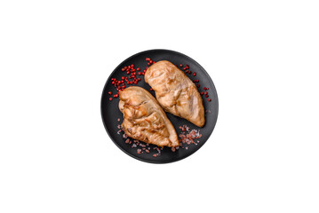 Delicious fresh grilled chicken fillet with salt, spices and herbs on a ceramic plate