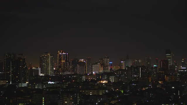 Aerial view of Bangkok metropolis cityscape night scene with light on buildings , condominium apartment hotel office building skyline