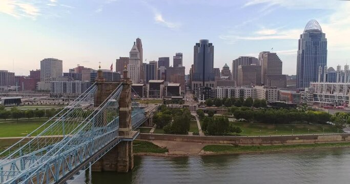 Drone shot of John A Roebline suspension bridge over the Ohio river with Cincinnati in the background