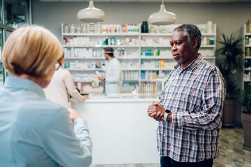 Portrait of a senior african american man customer in a pharmacy