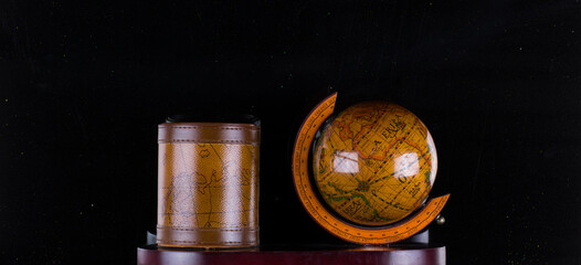 wooden ancient table globe isolated on black background