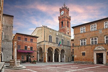 Pienza, Siena, Tuscany, Italy: the main square with the ancient city hall and the water well