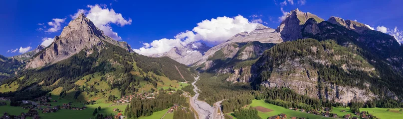Foto op Plexiglas Swiss nature scenery. Kandersteg village with stunning valley surrouded by high Alps mountains. popular tourist ski resort. Canton Bern, Switzerland, aerial panoramic view © Freesurf