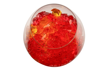 Sweet fruit jelly dessert in a glass isolated on a white background.
