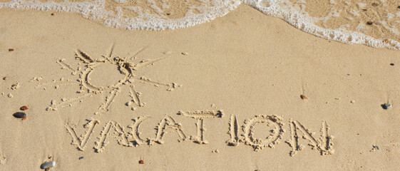 Inscription vacation with shape of sun and sea wave on sand at beach. Summer time
