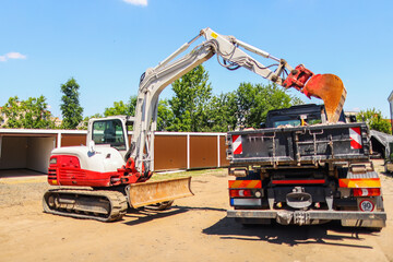 The excavator works with a truck