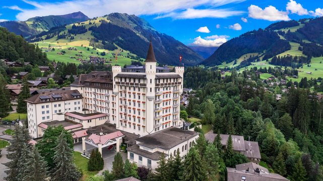 Gstaad - elegant and popular mountain ski resort in Swizerland, canton Bern. aerial drone panoramic view