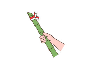 hand holding indonesian bamboo