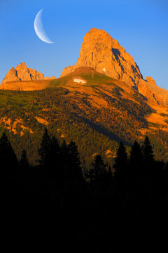 Grand Tetons and Table Mountain at Sunset with Crescent Moon