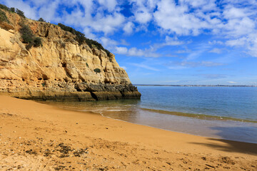 Fototapeta na wymiar Natural features, cliffs and limestone formations in Praia da Batata Beach