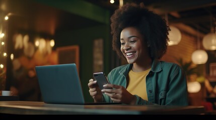 Happy African ethnic girl using mobile cell phone and laptop sitting at desk. Smiling Black teen college student looking at computer holding smartphone - generative AI, fiction Person