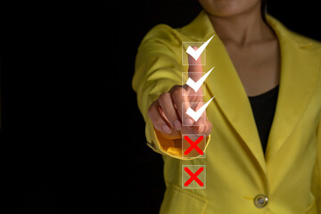 asian women in yellow suit with pointing to select check box 