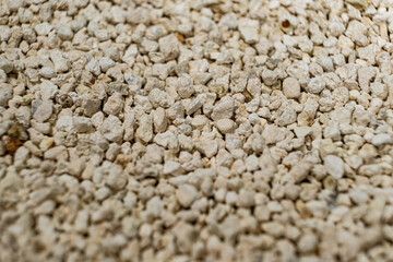 Bentonite clumping clay litter for cat litter box and pets close-up.