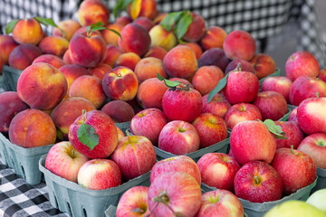 Fresh apples and peaches at a local farmer's market