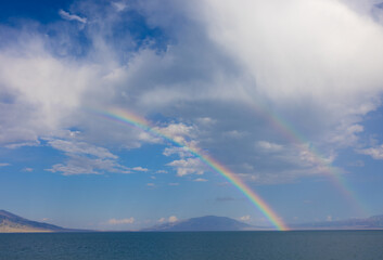 Two rainbows appear on the Sayram Lake in Xinjiang, China, after a rainy day