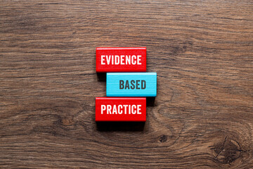Evidence based practice - word concept on building blocks, text