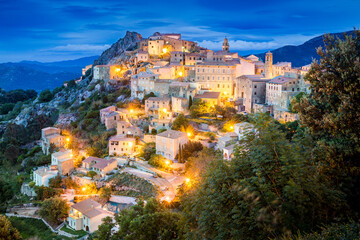 Ancient mountain village of Speloncato in evening lights in the Balagne region of Corsica island, France - obrazy, fototapety, plakaty