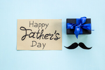 Happy Fathers day gixt box greeting card flatlay, top view