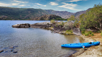 A kayak anchored on a beach, Sanabria Lake, Sanabria Lake Natural Park. Zamora province, Spain