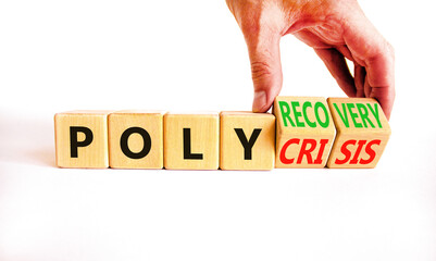 Polycrisis or polyrecovery symbol. Concept words Polycrisis Polyrecovery on wooden cubes. Beautiful white background. Businessman hand. Business Polycrisis or polyrecovery concept. Copy space.