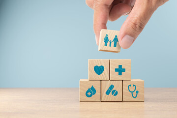 Health insurance concept. healthcare medical wooden cube block with icon, health and access to welfare health.3D render