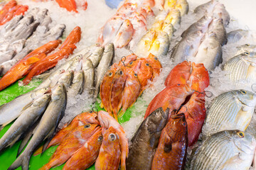 Fresh raw fish on ice at the fish market