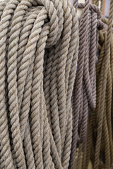 Close-up of three old rope coils on ship cleats, focus on the front.