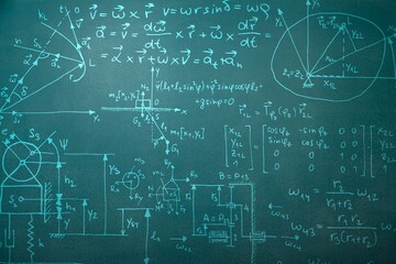Operations and formulas handwritten on chalk blackboard