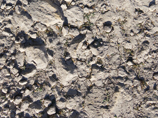 Abstract volumetric texture of gray color with strong shadows in the sun. Close