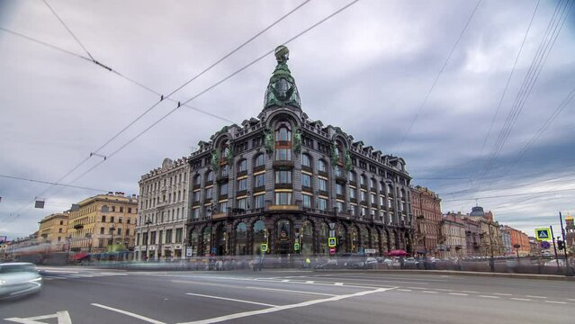 Singer House in Saint Petersburg takes center stage in this timelapse hyperlapse, featuring bustling road traffic. Nearby, tourists stroll along Nevsky Prospekt and the Griboyedov Canal