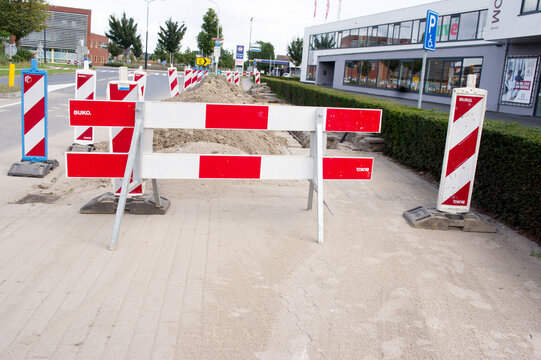 Elst, Netherlands - September 19, 2021: Work site closed with barriers in the center of Elst